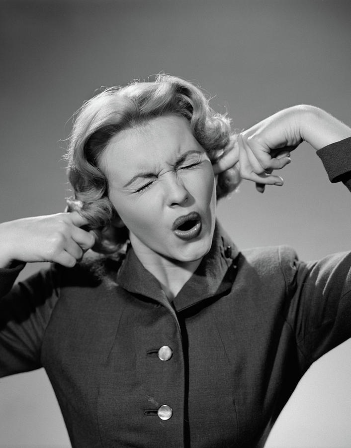 1950s Woman Portrait Fingers Plugging Photograph by Vintage Images ...