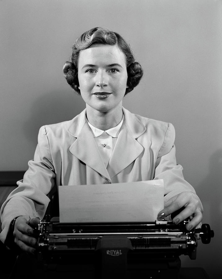 1950s Woman Secretary Seated At Desk ...