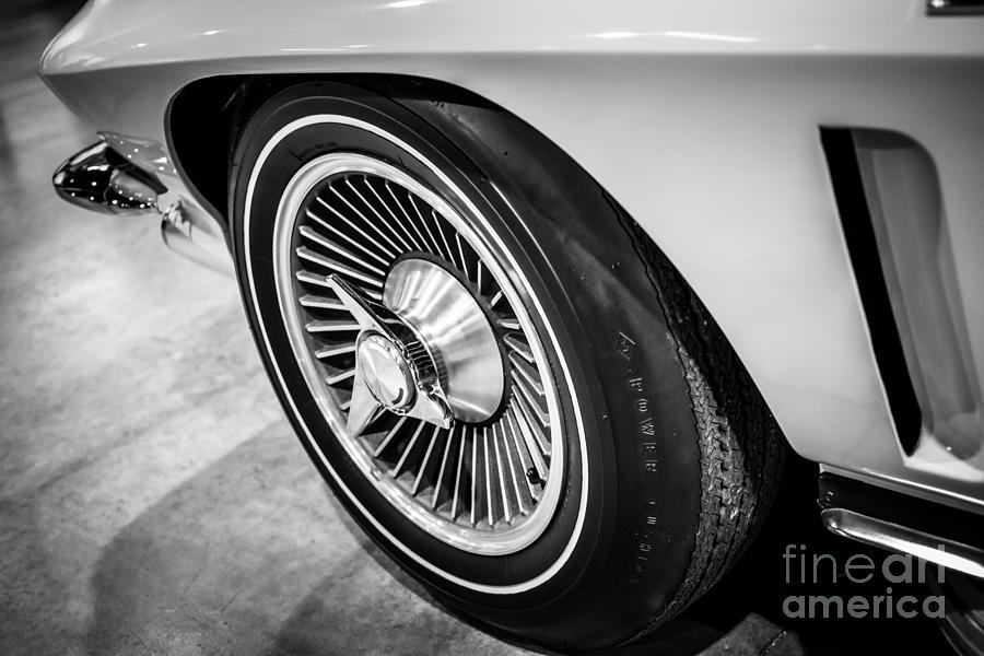 Black And White Photograph - 1960s Chevrolet Corvette C2 Spinner Wheel by Paul Velgos