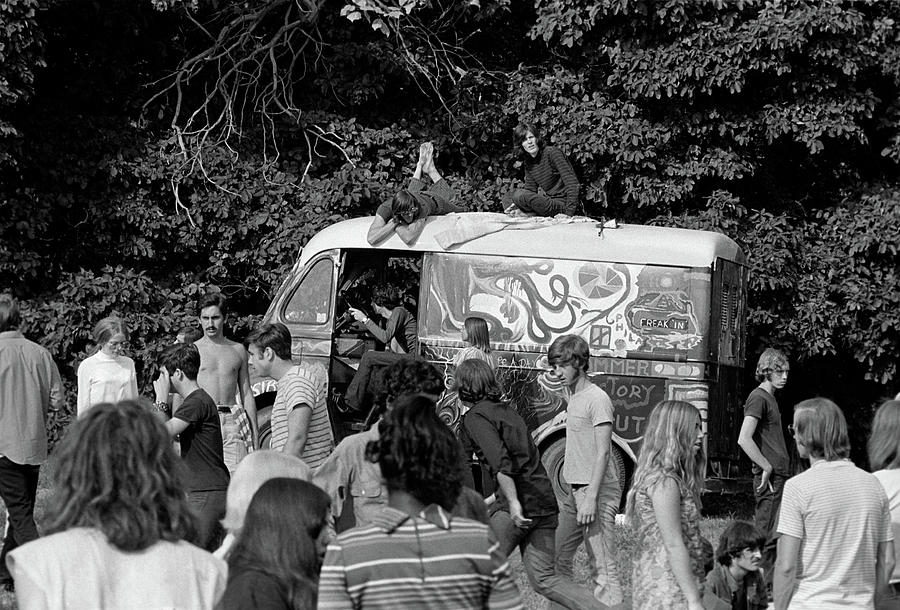Black And White Photograph - 1960s Gathering Of Hippie Kids In Woods by Vintage Images