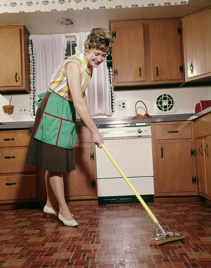 1960s Woman In Apron Cleaning