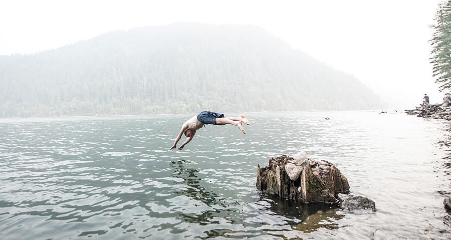 A Man Dives Into The Water Of Yale Lake Photograph by Alasdair Turner ...