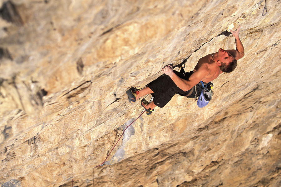 A Man Rock Climbing A Difficult Photograph By Corey Rich