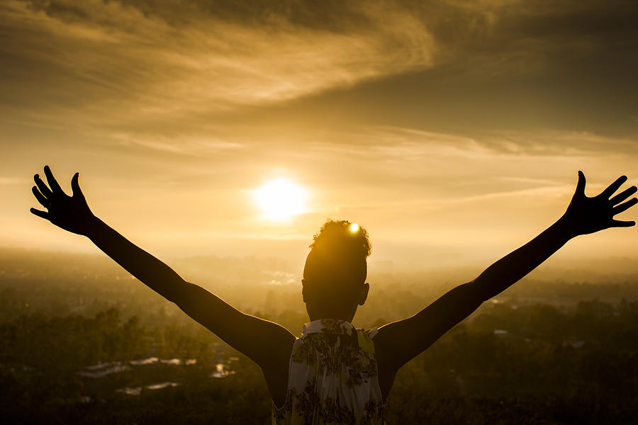 African American Woman Raising Arms at Sunset #2 Photograph by Adamkaz