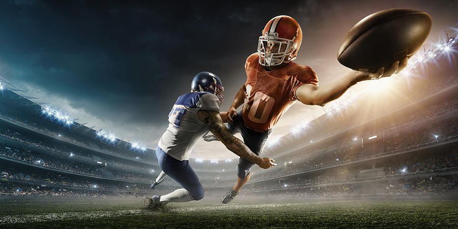 American football player being tackled #2 Photograph by Dmytro Aksonov