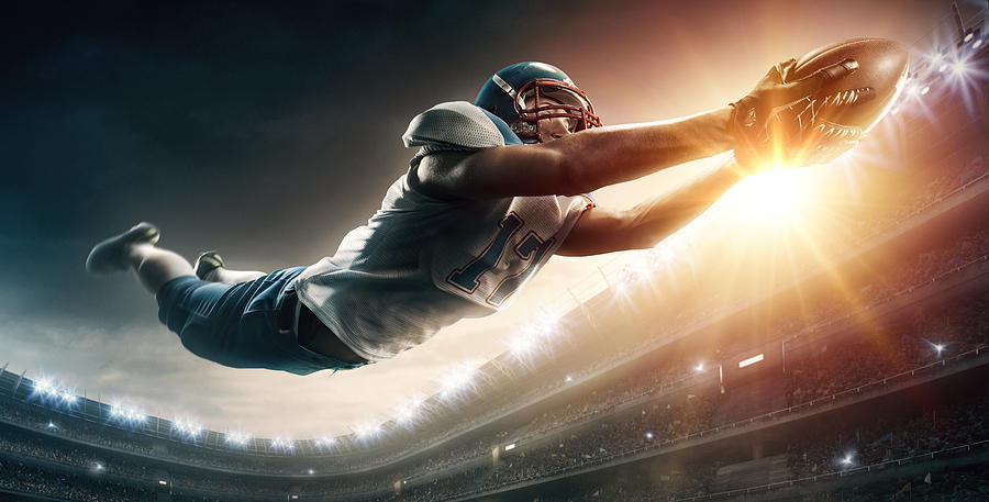 American football player jumping #2 Photograph by Dmytro Aksonov