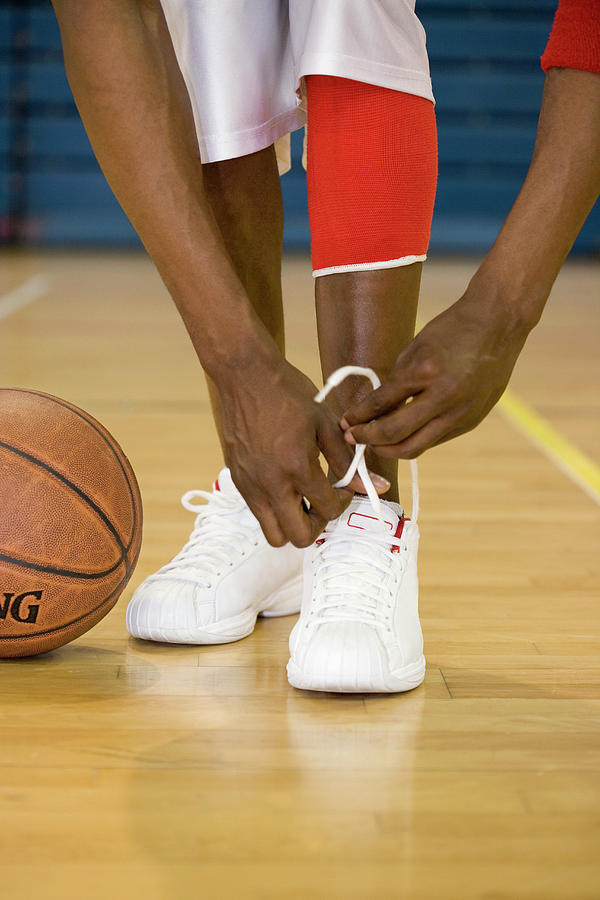 Basketball Spinning On A Finger by Gustoimages/science Photo Library