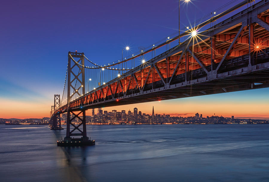 Bay Bridge and San Francisco skyline at sunset #2 Photograph by Spondylolithesis