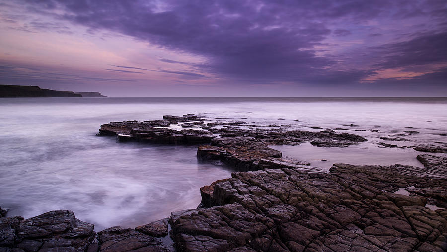 Sunset Photograph - Beautiful toned seascape landscape of rocky shore at sunset #2 by Matthew Gibson