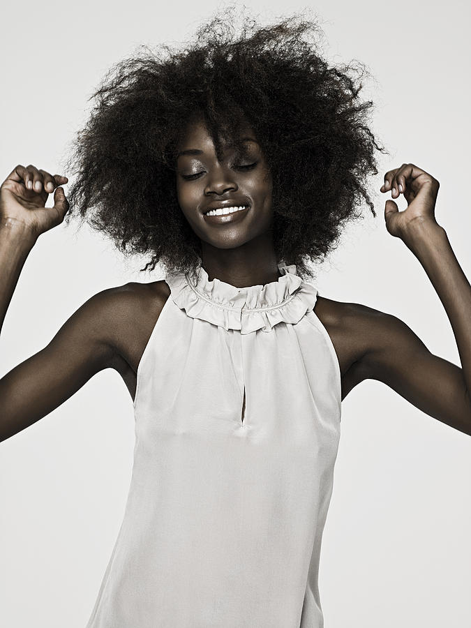 Beautiful young woman with an afro #2 Photograph by Image Source