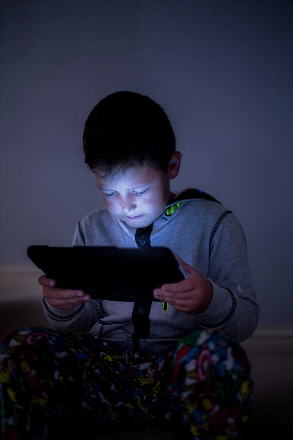 Boy Using A Digital Tablet In The Dark #2 Photograph by Samuel Ashfield