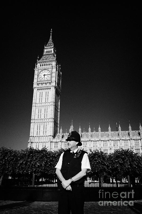 Westminster Photograph - british metropolitan police office guarding the houses of parliament London England UK #2 by Joe Fox