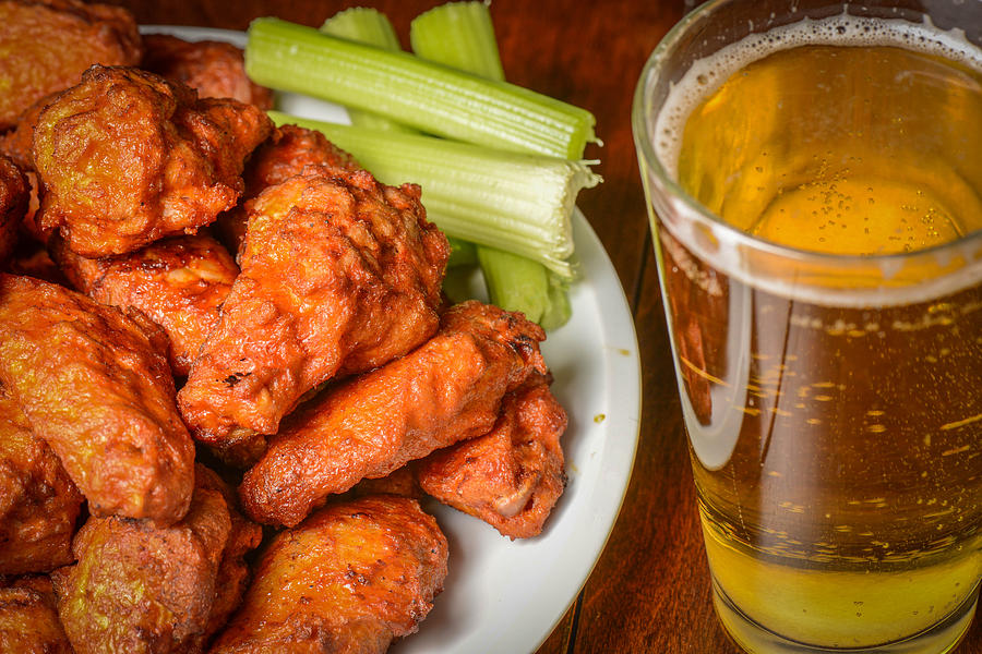 Buffalo Wings With Celery Sticks And Beer Photograph