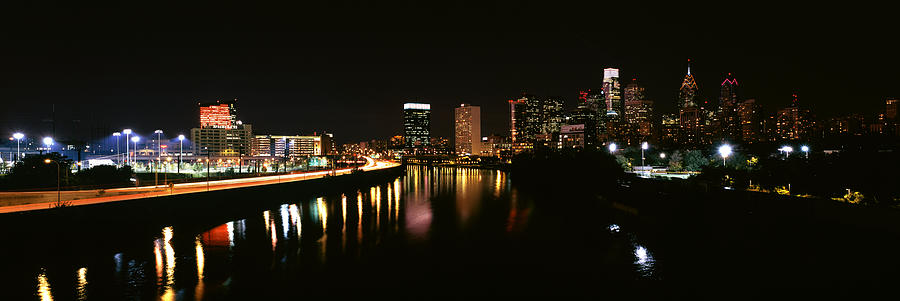 Architecture Photograph - Buildings Lit Up At The Waterfront #2 by Panoramic Images