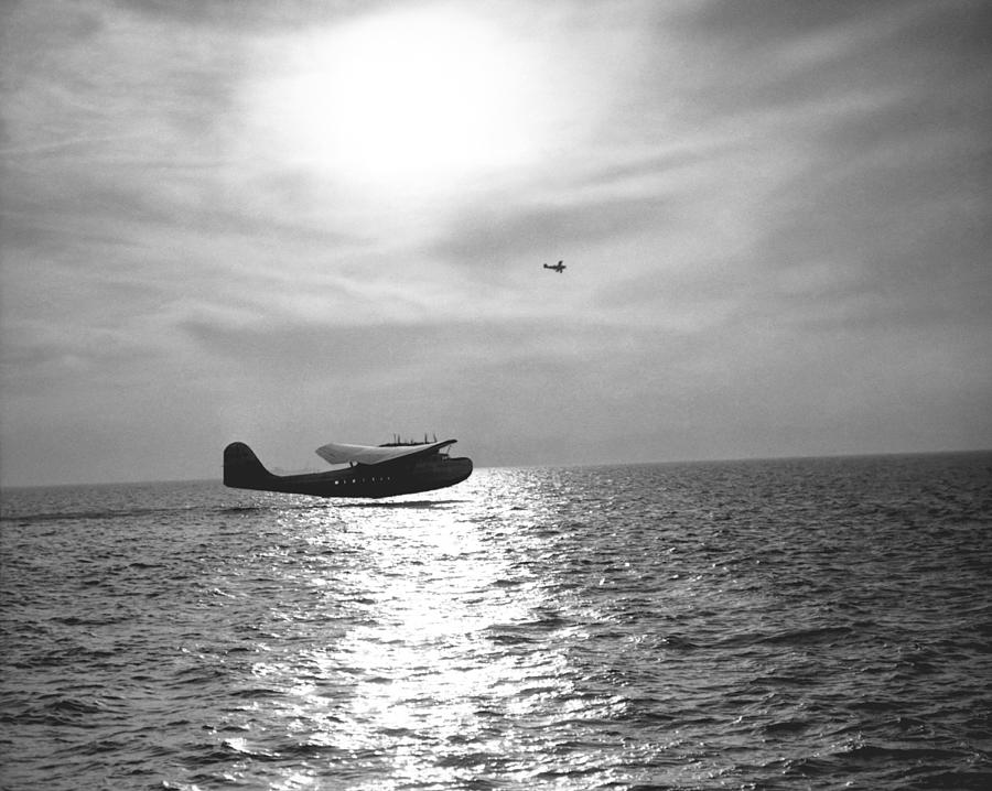 Black And White Photograph - China Clipper Seaplane #1 by Underwood Archives