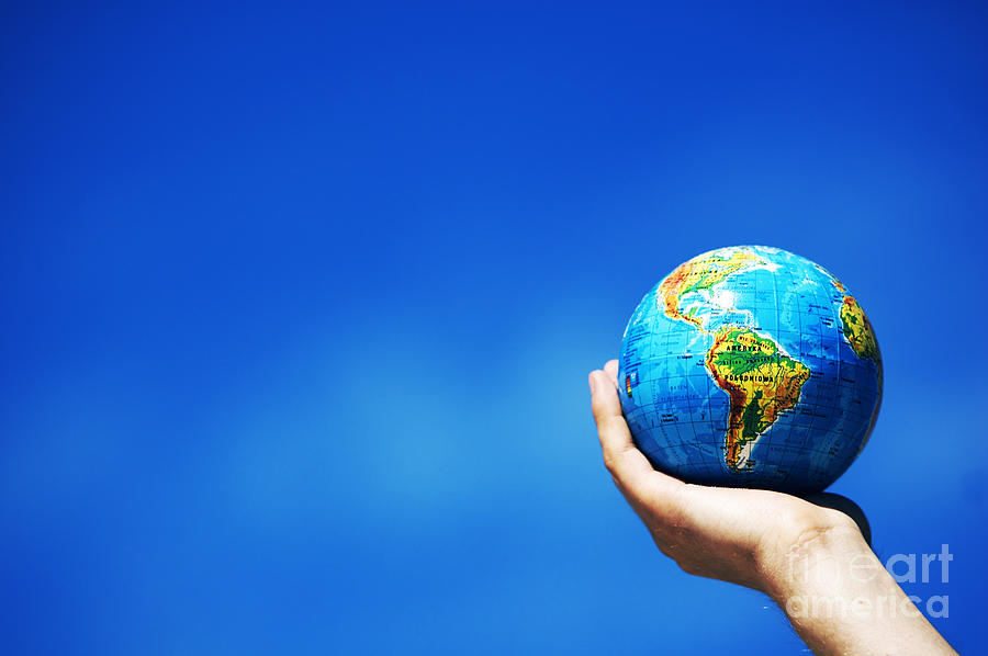 Earth globe in hands. Conceptual image #2 Photograph by Michal Bednarek