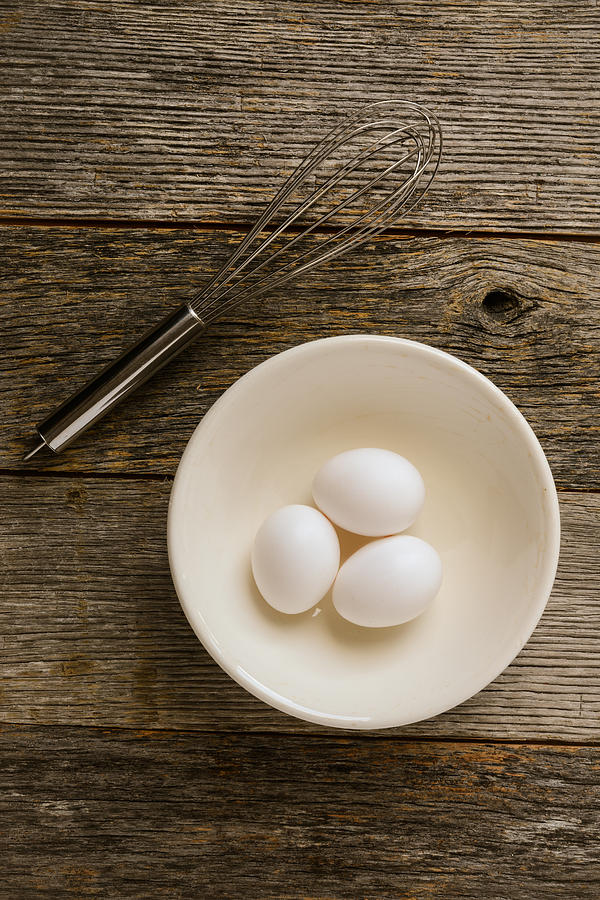 Tool Photograph - Eggs in a Bowl with a Whisk on Rustic Wood Background #2 by Brandon Bourdages