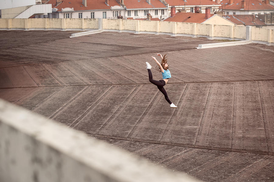 Female ballet dancer dancing on a rooftop in Lyon, France #2 Photograph by Yanis Ourabah