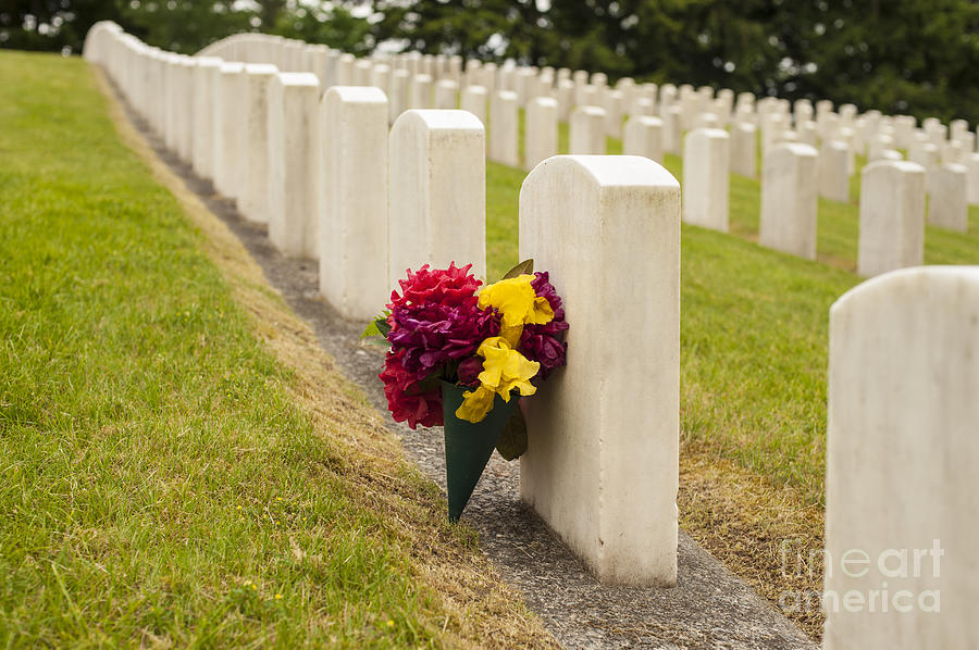 Flowers placed at soldiers gravesite #2 Photograph by Jim Corwin