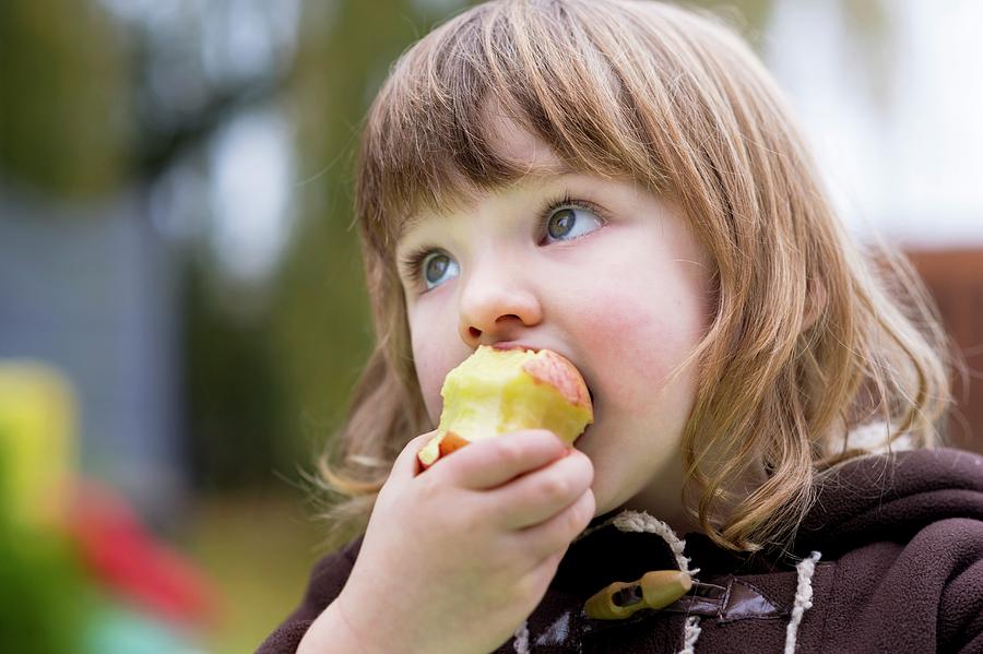 Girl Eating An Apple #2 Photograph by Aberration Films Ltd