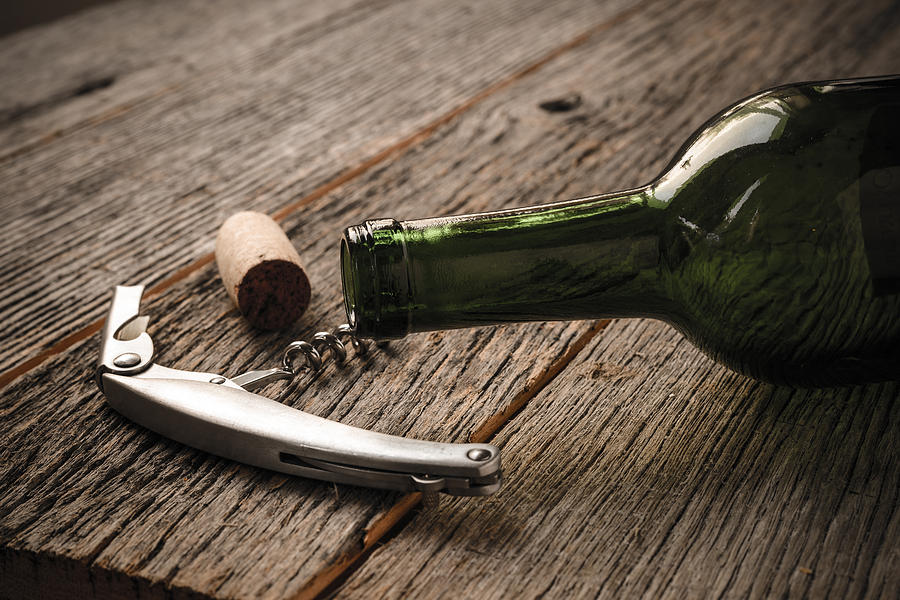 Wine Photograph - Green Wine Bottle and Cork with Red Wine and corkscrew #2 by Brandon Bourdages