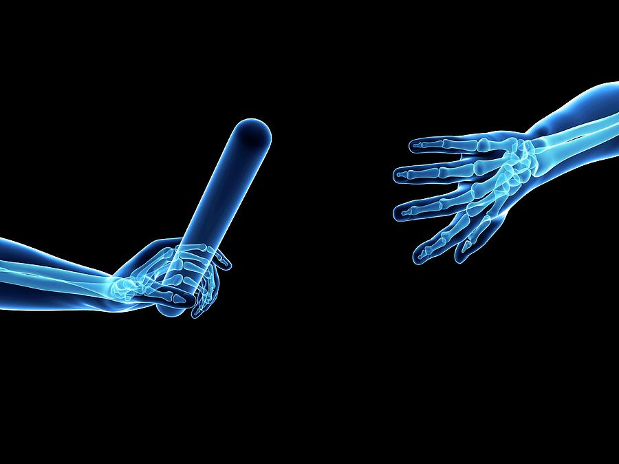 Human Hand Passing Relay Baton #2 Photograph by Sebastian Kaulitzki