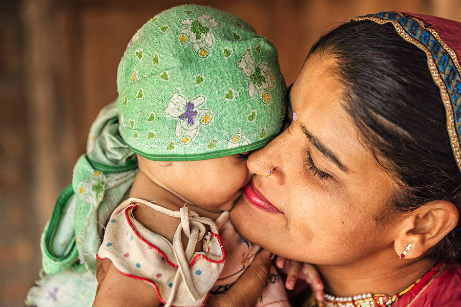 Indian woman with her newborn daughter, Bishnoi village #2 Photograph by Bartosz Hadyniak