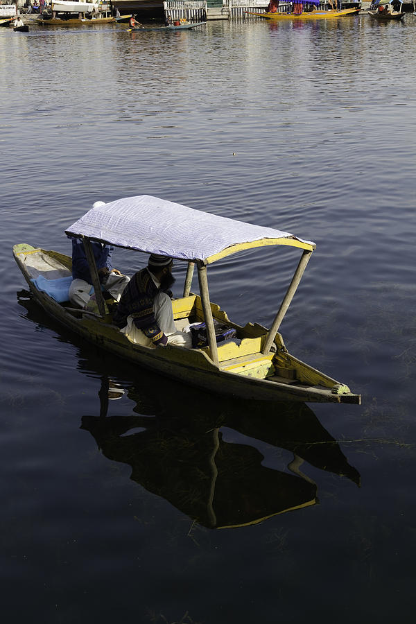 2 Kashmiri men in a small boat in the Dal Lake in Srinagar Photograph by Ashish Agarwal
