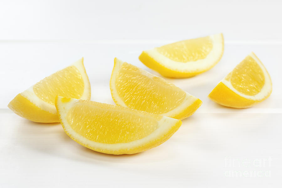 Lemon Photograph - Lemon Wedges on White Background #2 by Colin and Linda McKie
