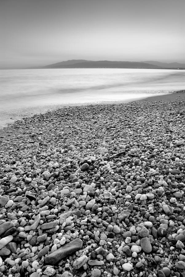 Black And White Photograph - Little Stones At The Silver Sea by Guido Montanes Castillo