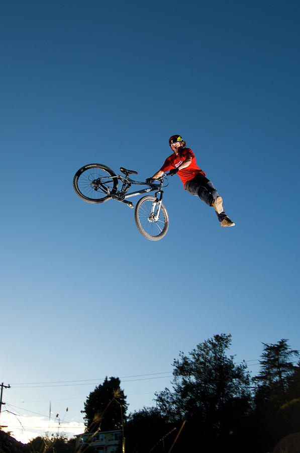 Bicycle Photograph - Man Dirt Jumping On His Mountain Bike #2 by Scott Markewitz