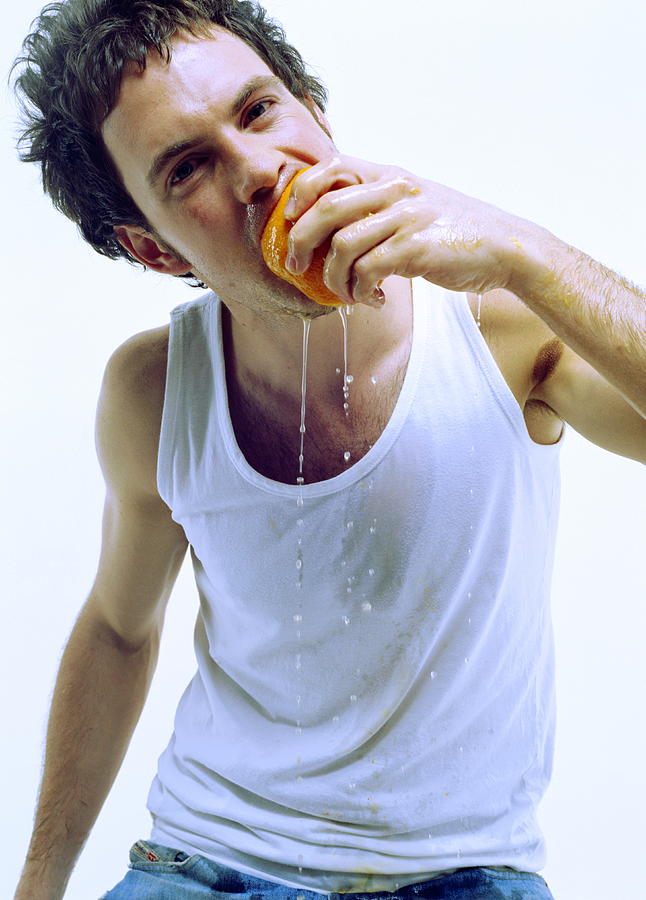 Man Eating Orange #2 Photograph by Jason Kelvin/science Photo Libray