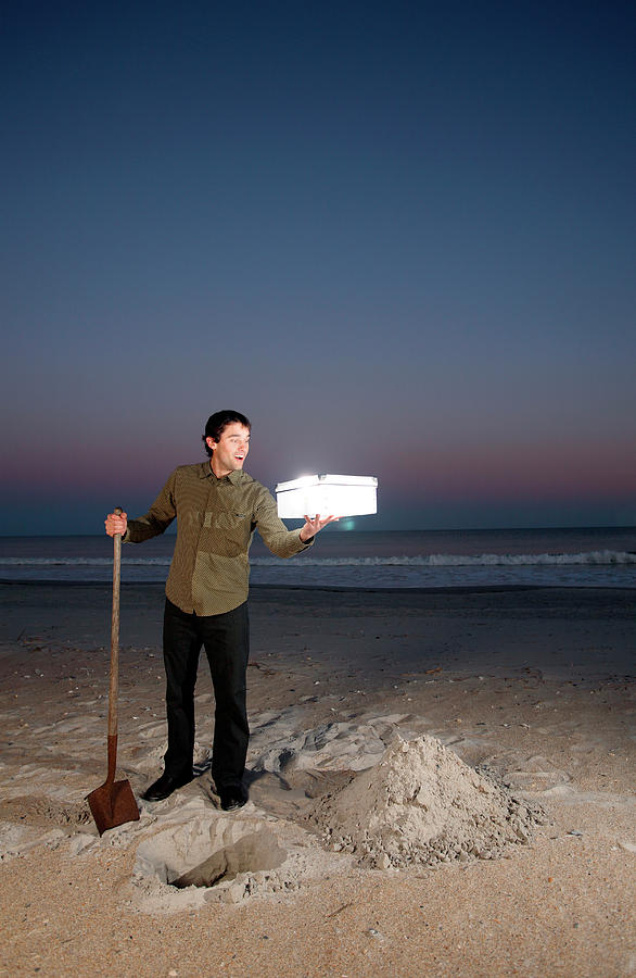 Sunset Photograph - Man Holds Glowing Box On Beach #2 by Logan Mock-Bunting