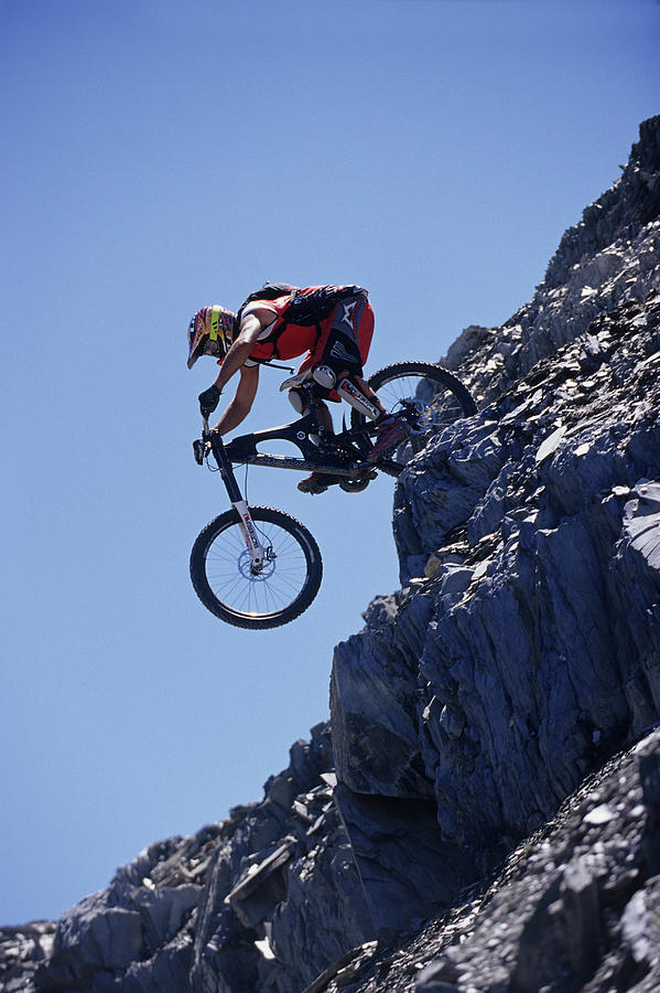 Man Making A Jump On His Mountain Bike Photograph by Scott Markewitz ...