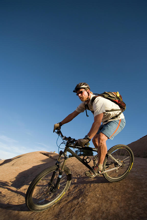 Nature Photograph - Man Mountain Biking, Moab, Utah #2 by Whit Richardson