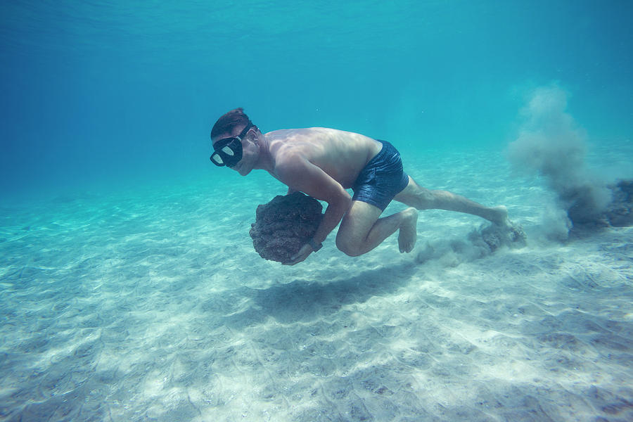 Man Walking With Stone Underwater Photograph By Konstantin Trubavin ...