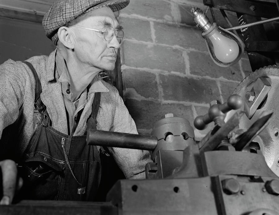 Man Working In A Small Machine Shop Photograph by Stocktrek Images