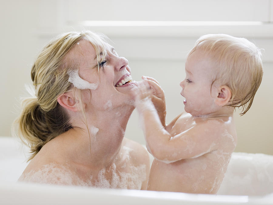 Mother And Baby Taking A Bubble Bath #2 Photograph by RubberBall Productions