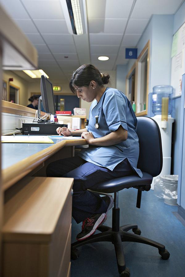 Nurse Writing Up Notes #2 Photograph by Lewis Houghton/science Photo Library