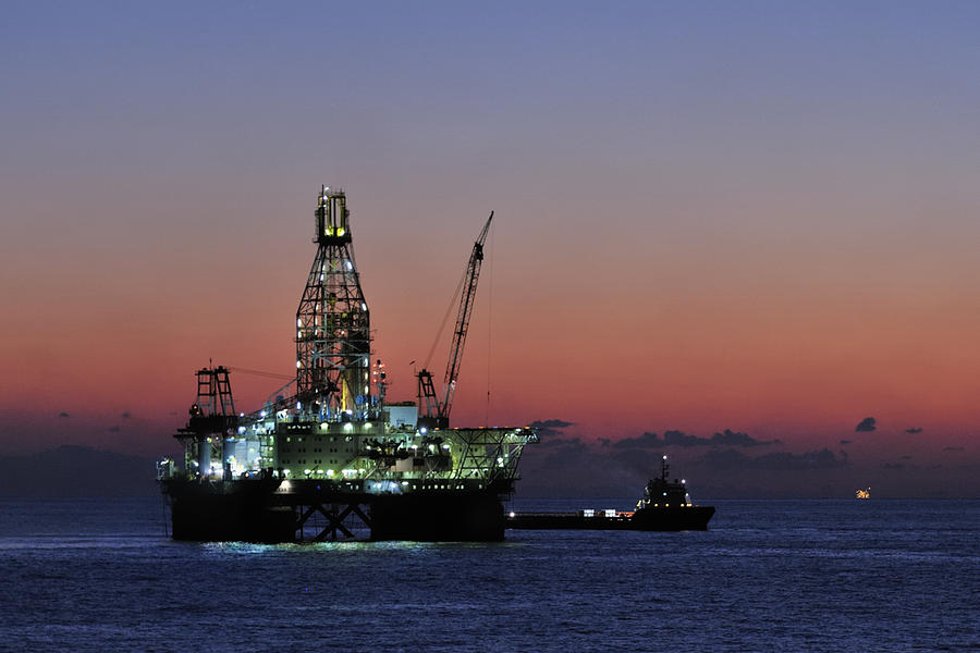 Oil rig and ship at dawn Photograph by Bradford Martin