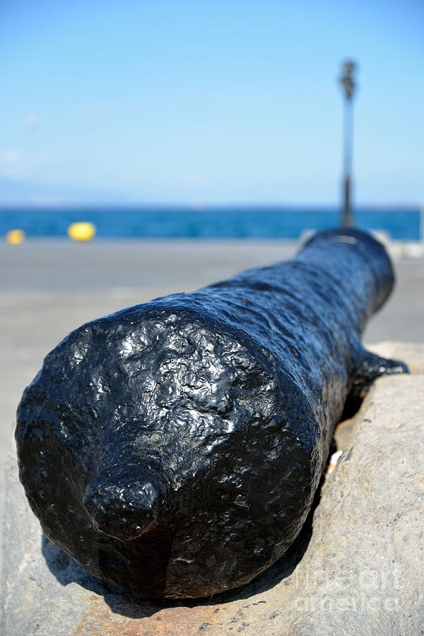 Old cannon in Aegina port #1 Photograph by George Atsametakis