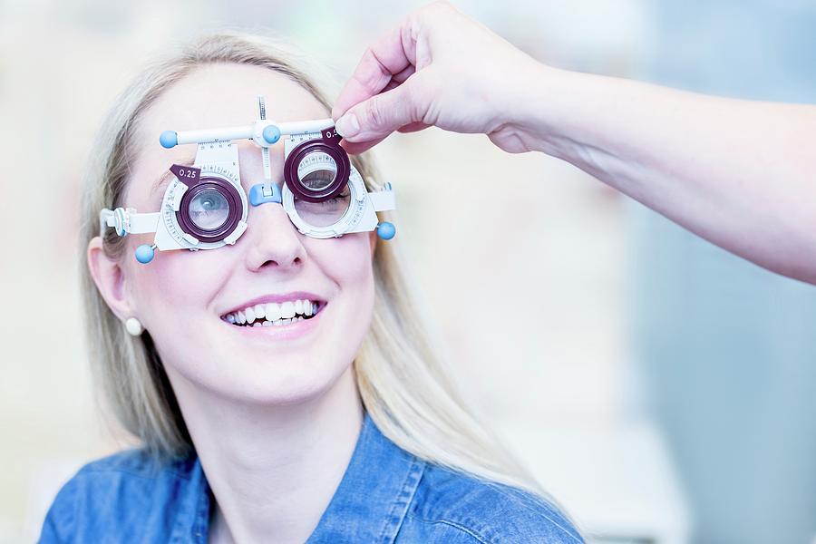 Optometrist Examining Woman's Vision Photograph by Science Photo Library