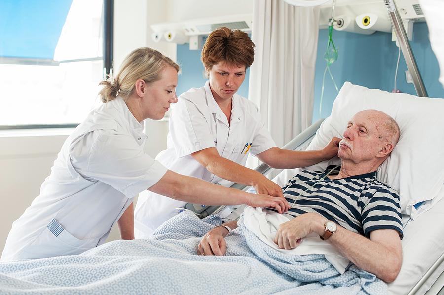 Patient With Nurses Photograph By Arno Massee Science Photo Library