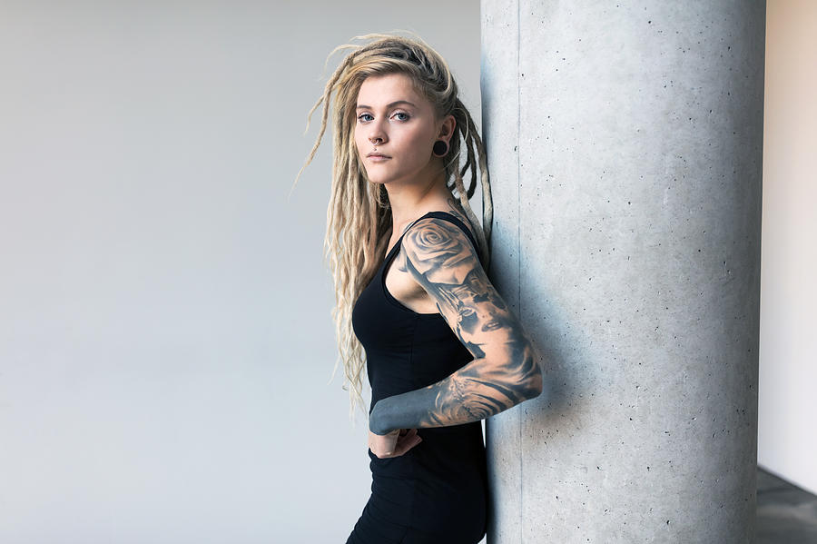 Portrait of tattooed and pierced young women with blond dreadlocks #2 Photograph by Kamisoka