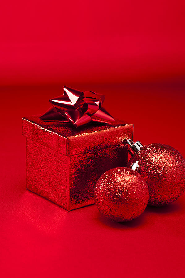 Red bauble and Christmas present #2 Photograph by U Schade