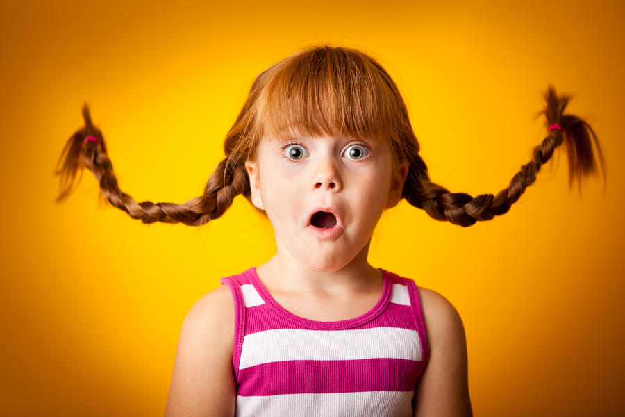 Red-Haired Girl with Upward Braids and Look of Surprise #2 Photograph by Ideabug