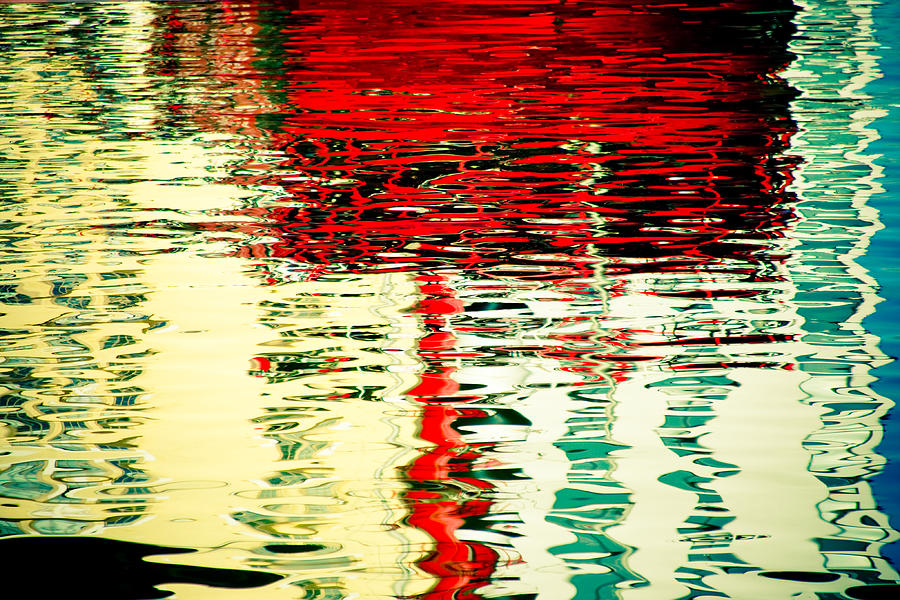 Reflection In Water Of Red Boat Photograph