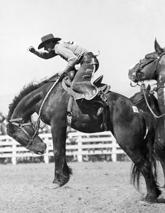 Riding A Bucking Bronco #2 Photograph by Underwood Archives