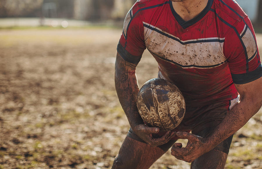 Rugby player standing on a playing field with ball #2 Photograph by South_agency
