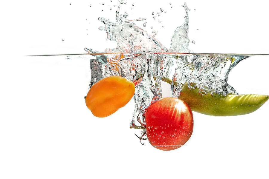 Splashing Tomatoes #2 Photograph by Peter Lakomy